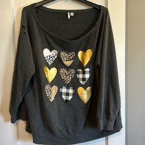 Gray distressed, oversized sweatshirt with metallic and animal print hearts.